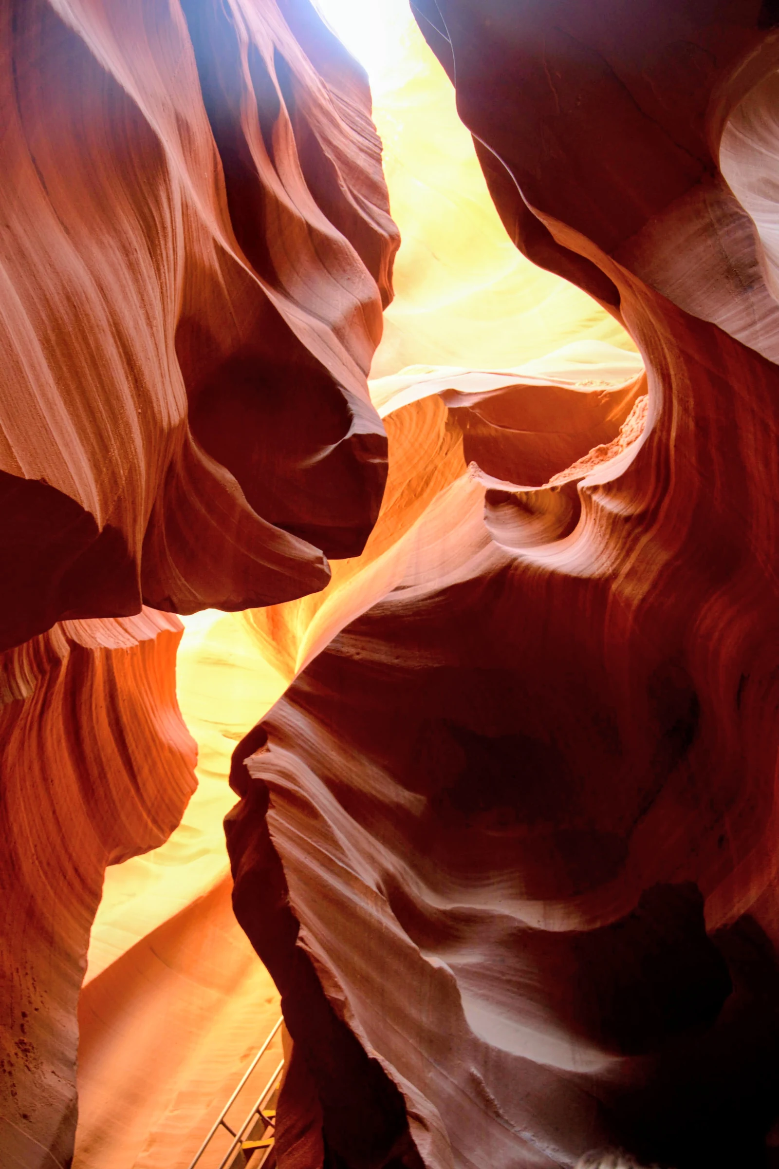 Sunlight pouring through the sculpted red sandstone walls of Antelope Canyon.