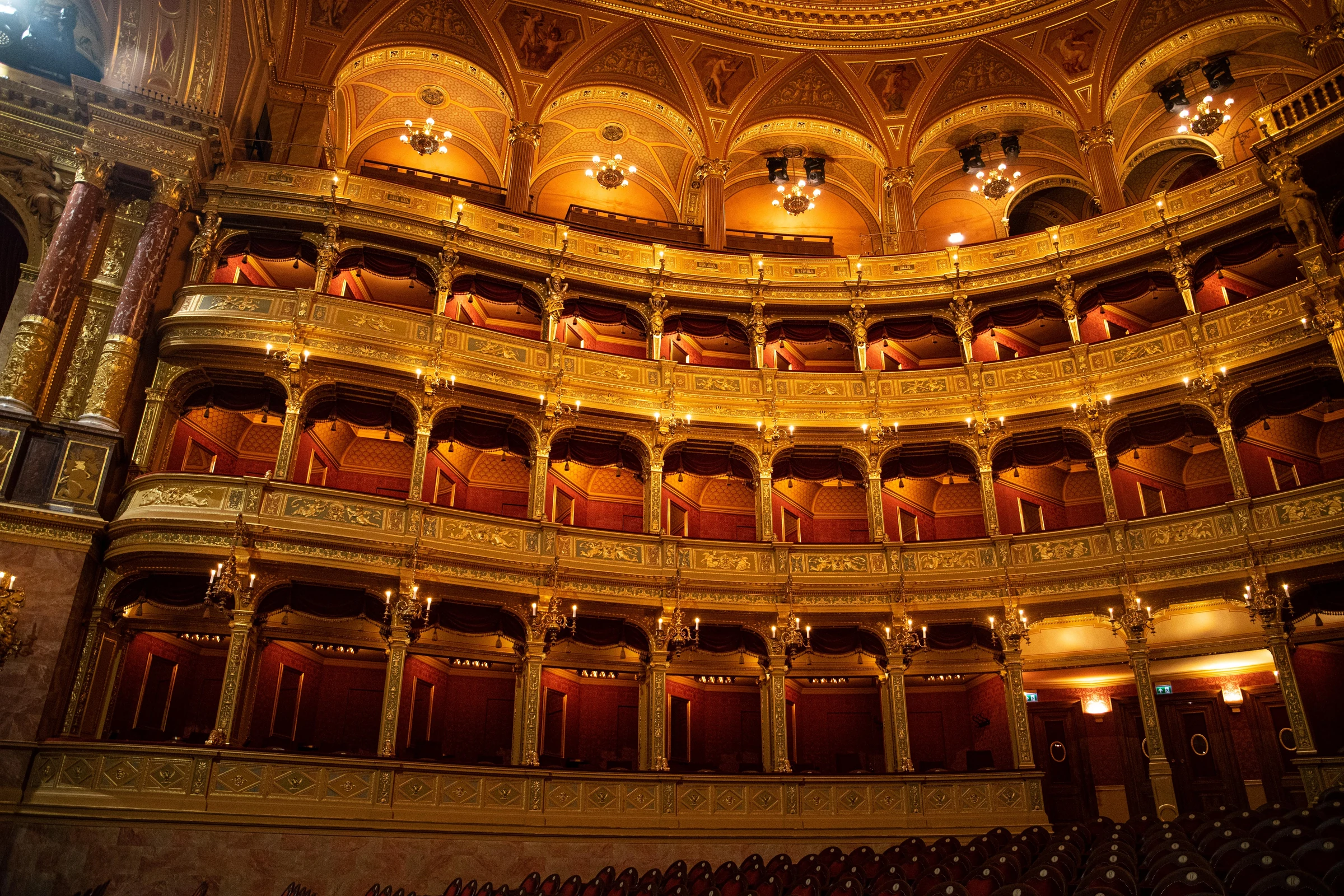 The gilded tiers and painted ceiling of the Hungarian State Opera House.